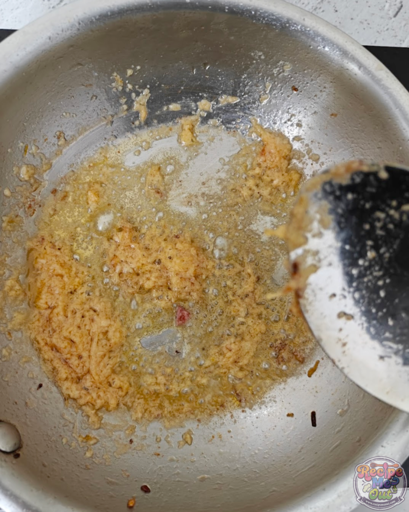 Garlic being sautéed in butter until fragrant for the pumpkin pasta sauce.