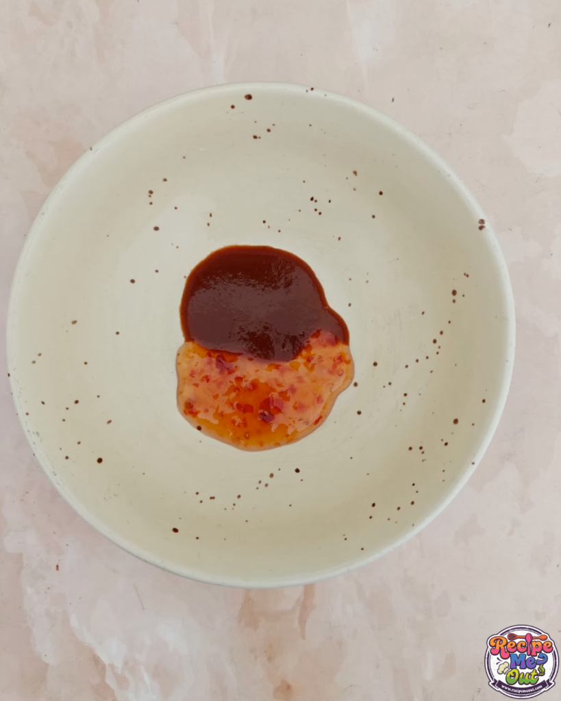 Mixture of Sriracha Sauce and Sweet Chilli Sauce Poured into a bowl.