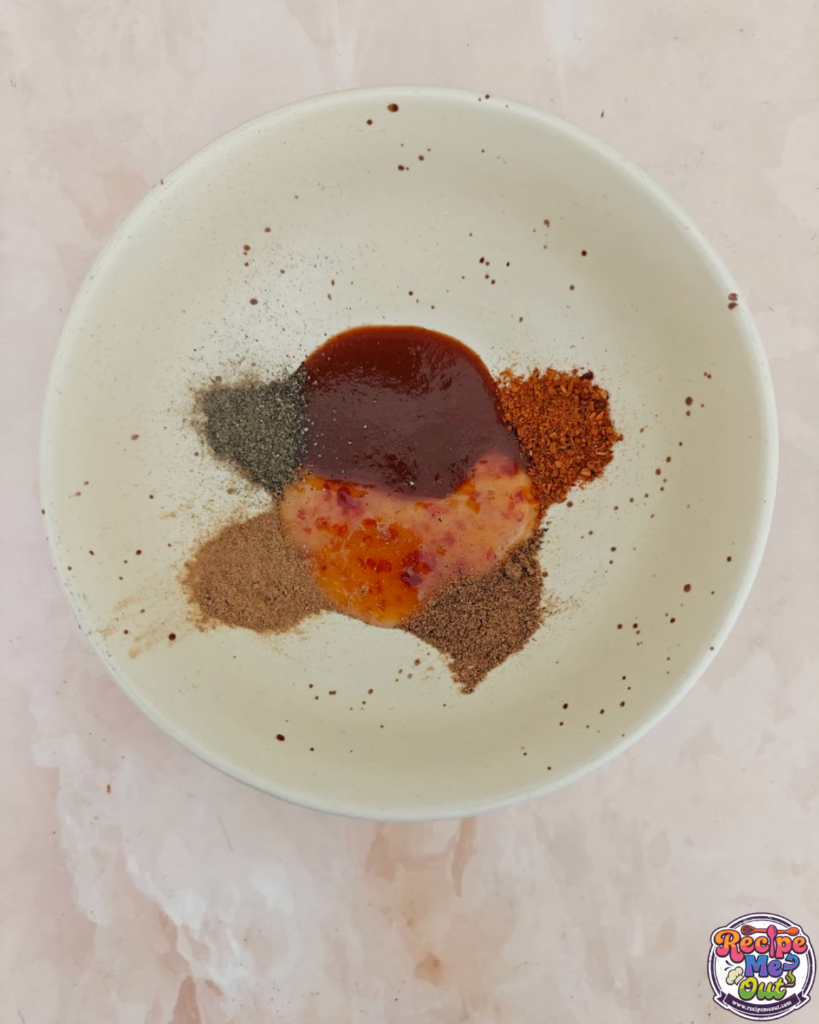 All the spices being poured into the bowl. 