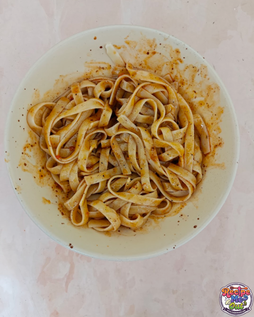 the pasta completely mixed in the sauce