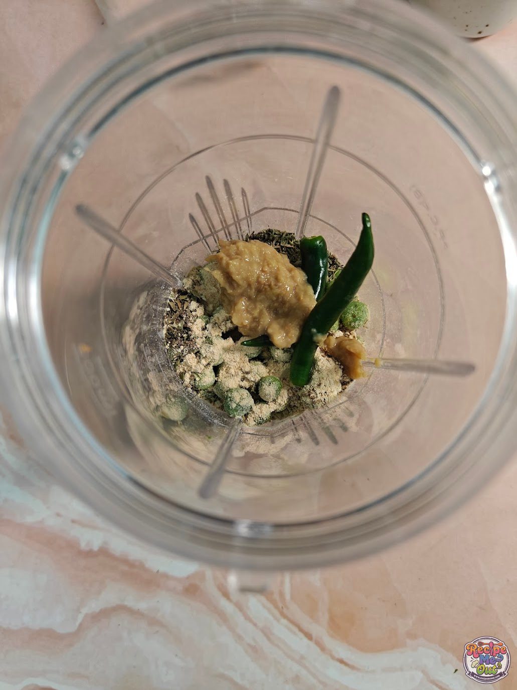 Ginger paste added to blender with peas and spices for Green Peas Pasta