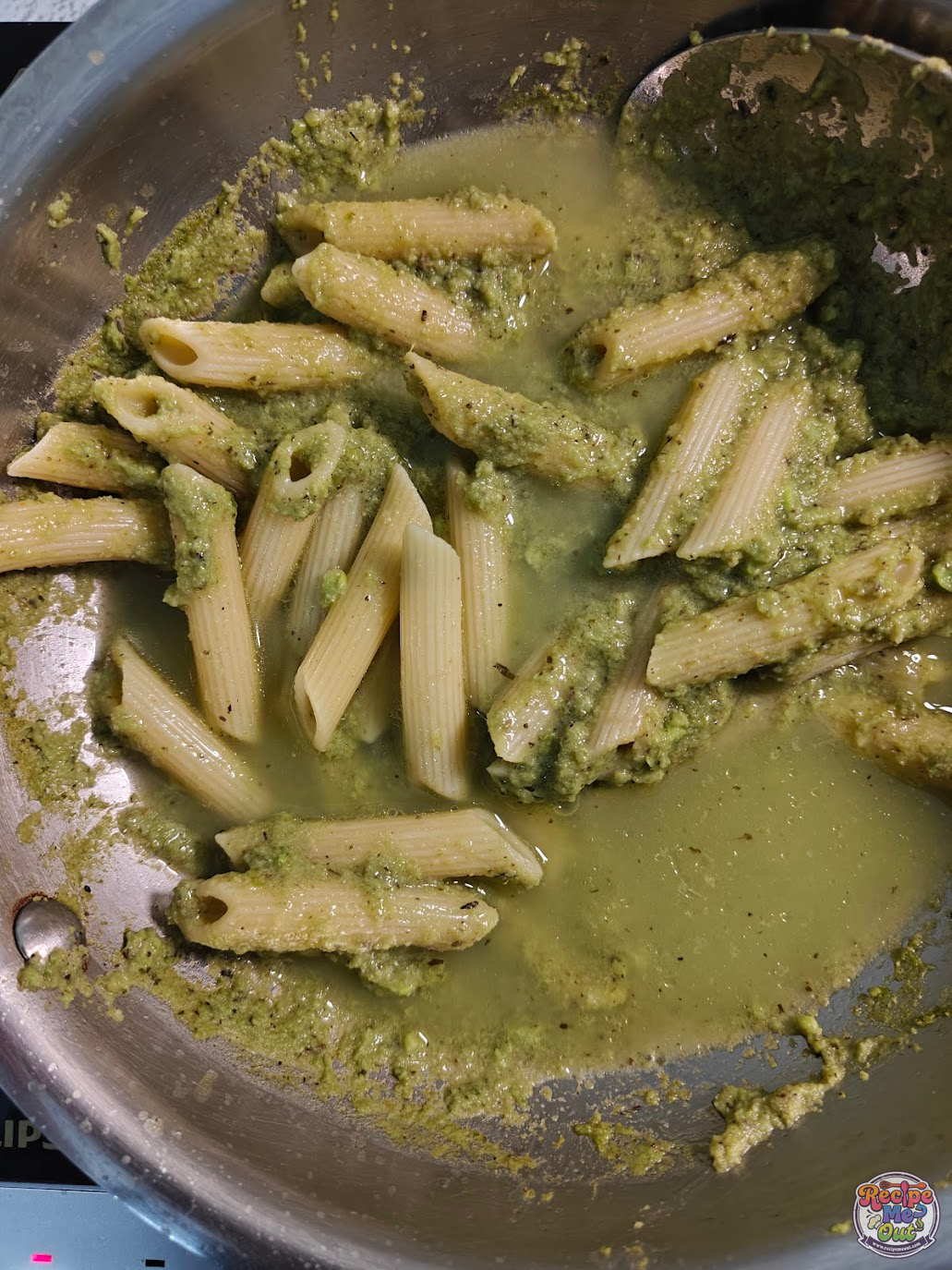 Pasta water added to green peas pasta sauce to adjust consistency
