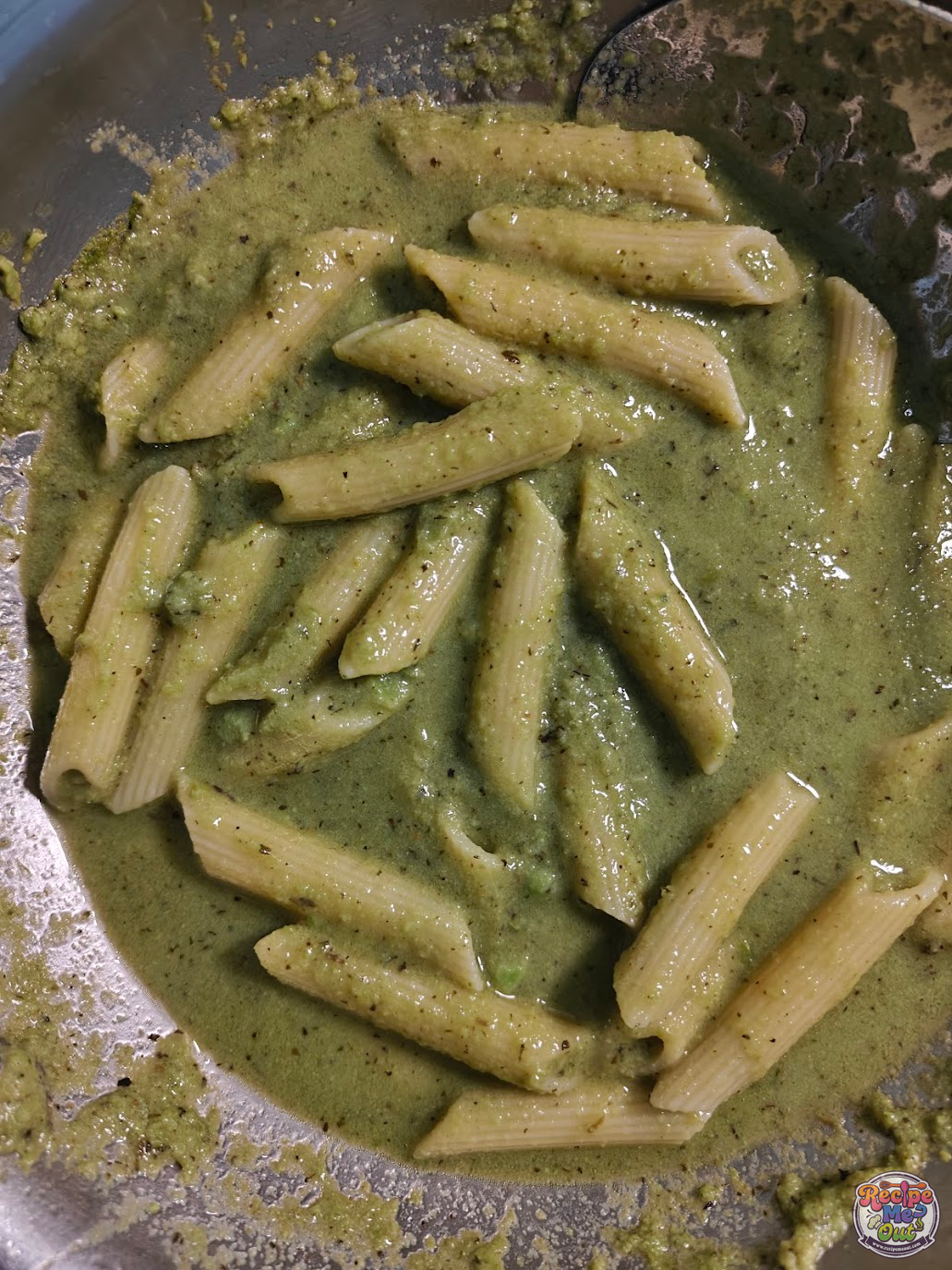 Green Peas Pasta almost ready in pan with penne coated in green peas sauce