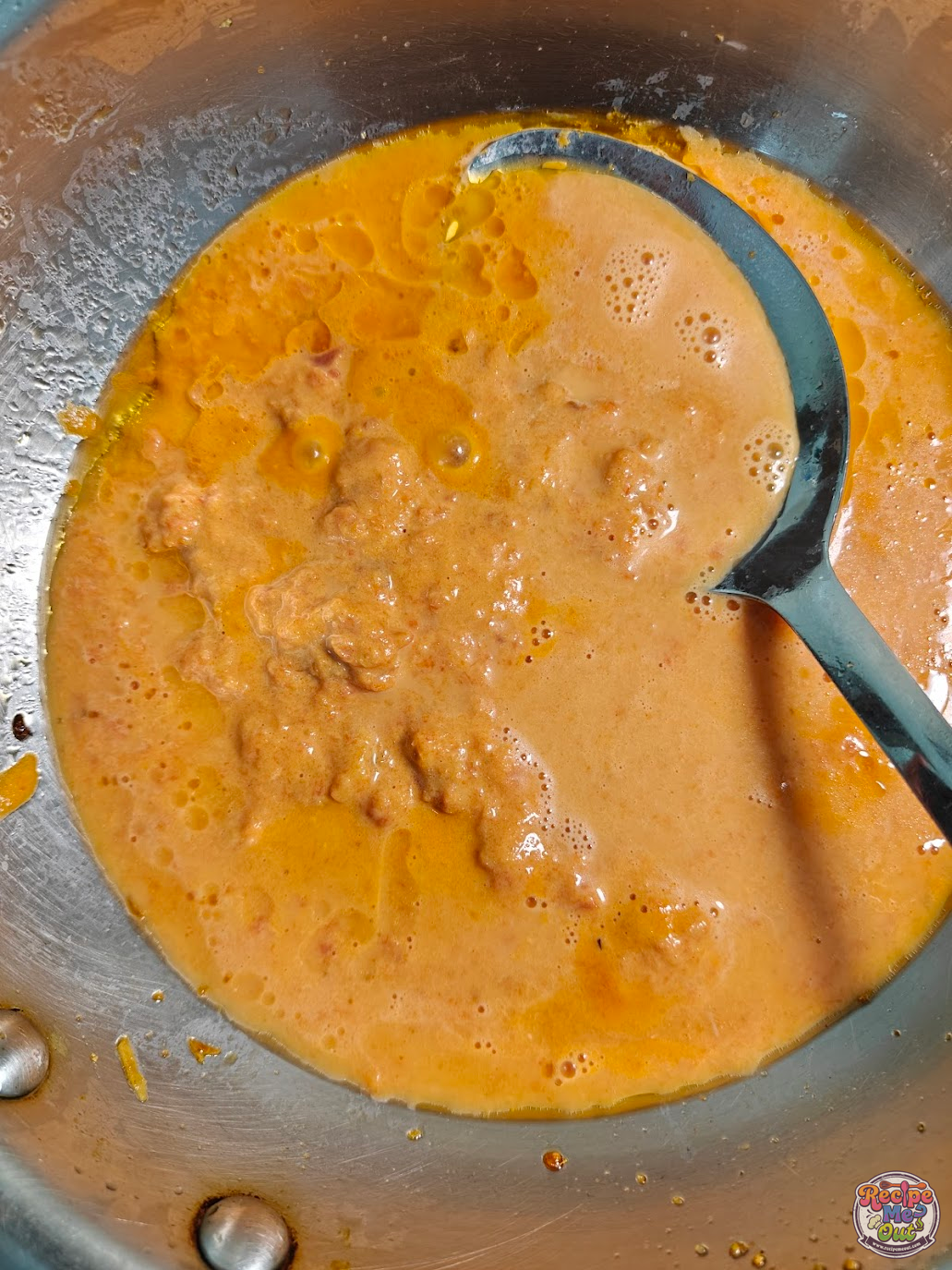 Carrot sauce simmering in the pan