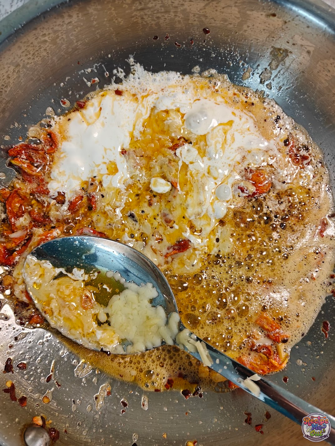 Fresh cream poured into the pan creating a creamy sauce