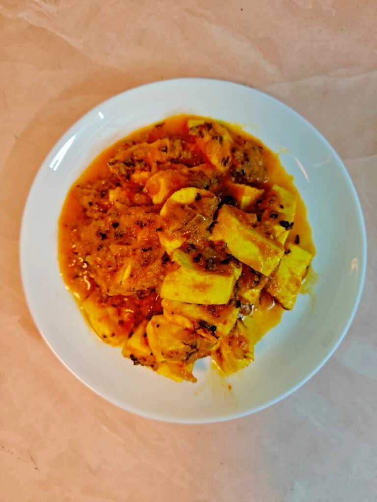 Overhead shot of Paneer Masala on a White Plate