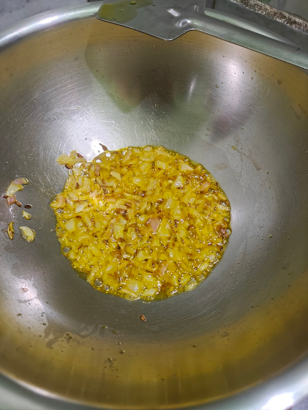 Chopped onions sautéing in oil
