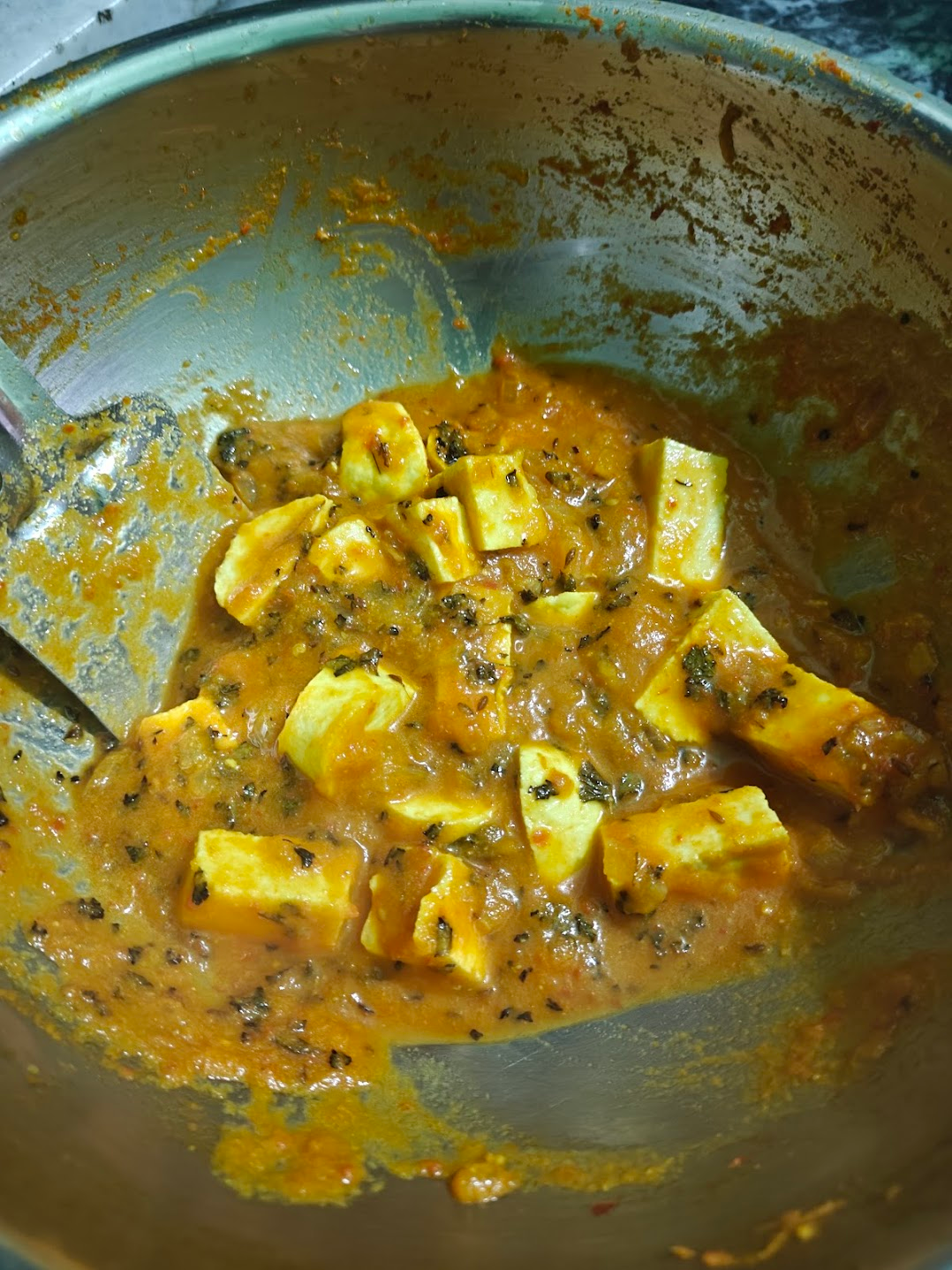 Paneer cubes simmering in creamy tomato onion gravy with kasuri methi.