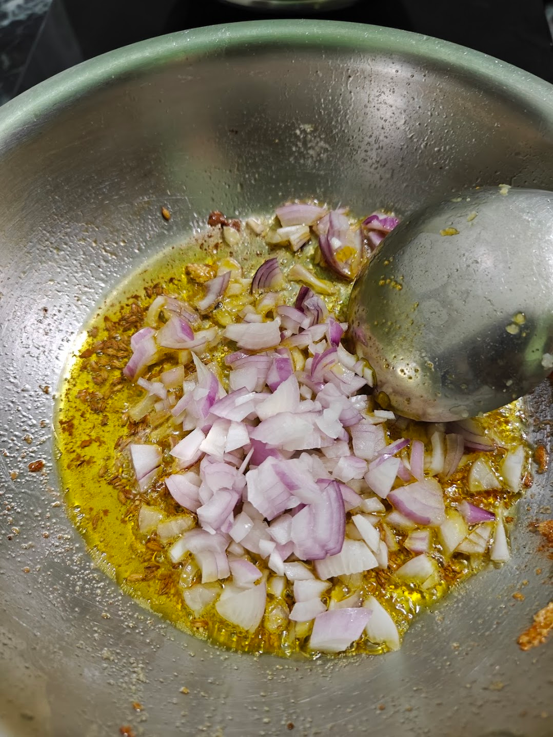 chopped onions added to the pan