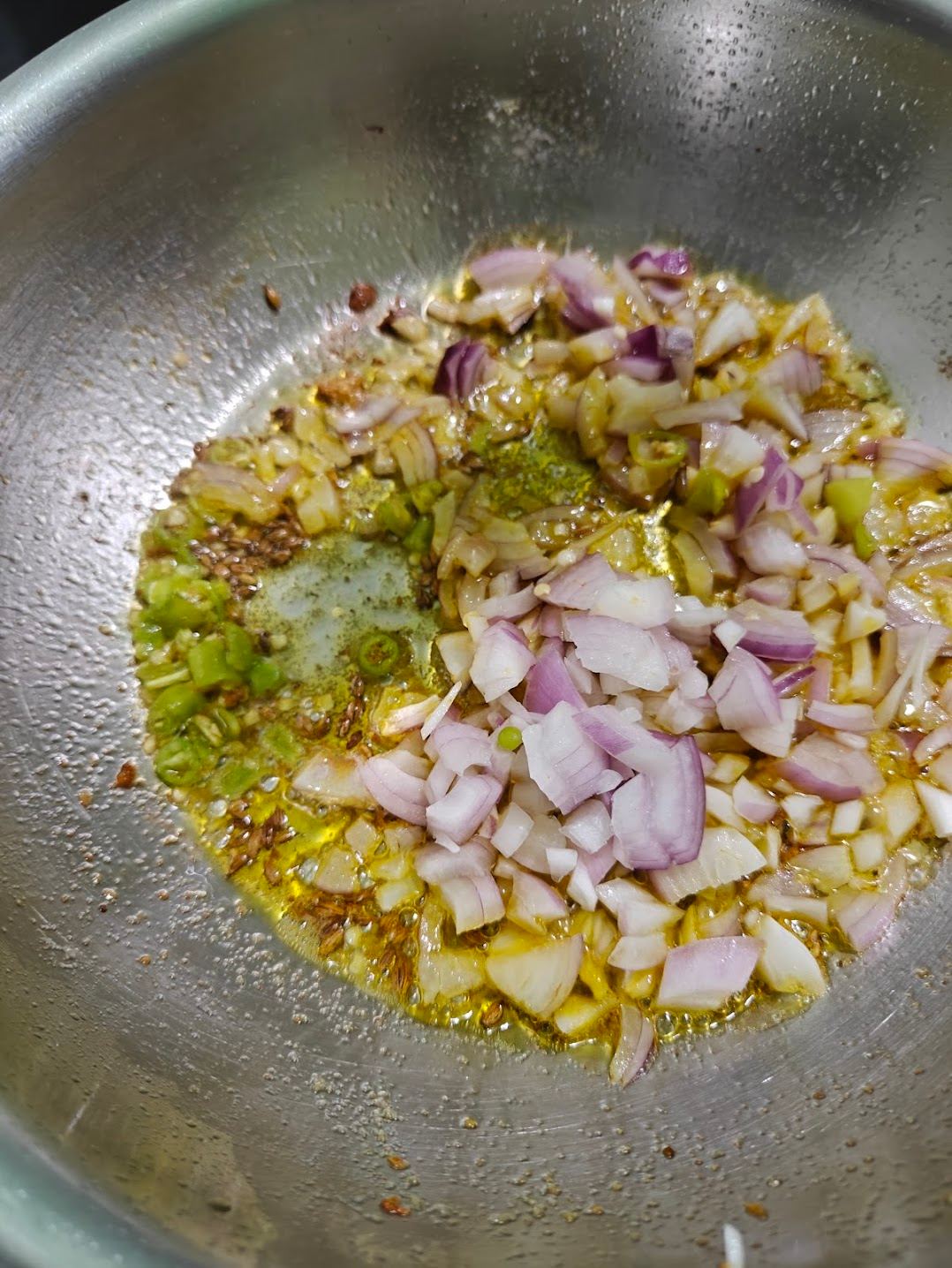 chopped green chillies added to the pan after adding the onions