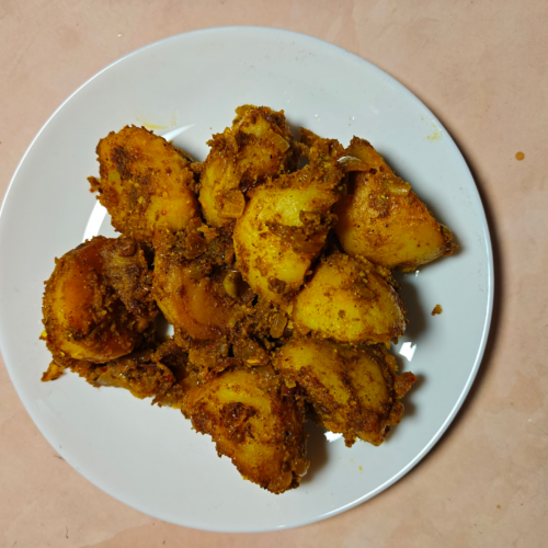 Achari Aloo (Pickled Potatoes) on a White Plate