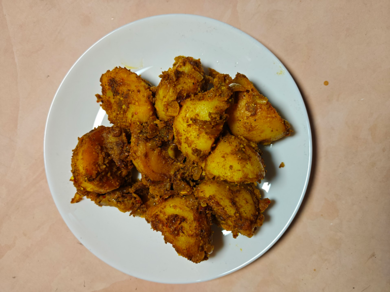 Achari Aloo (Pickled Potatoes) on a White Plate